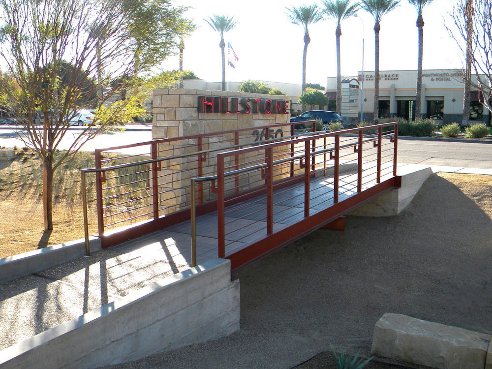 Hillstone Restaurant. Steel painted railing with stainless steel cables and handrail.