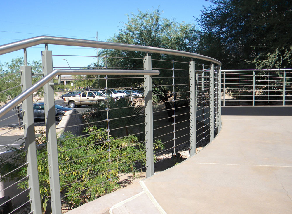 Southland - Stainless steel cables and handrail with painted steel post.