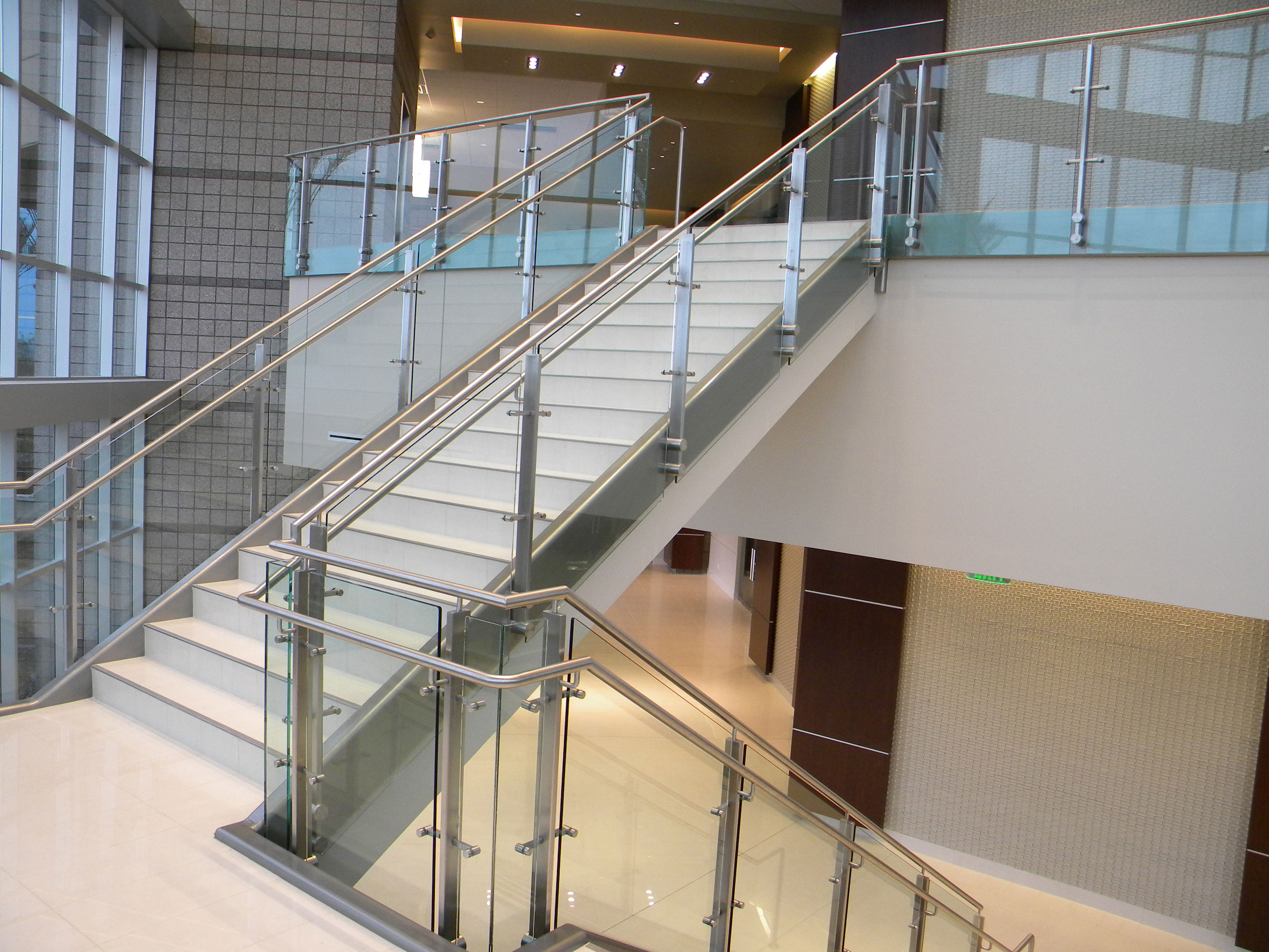 Continuim - glass with stainless steel post, cap rail and handrail.