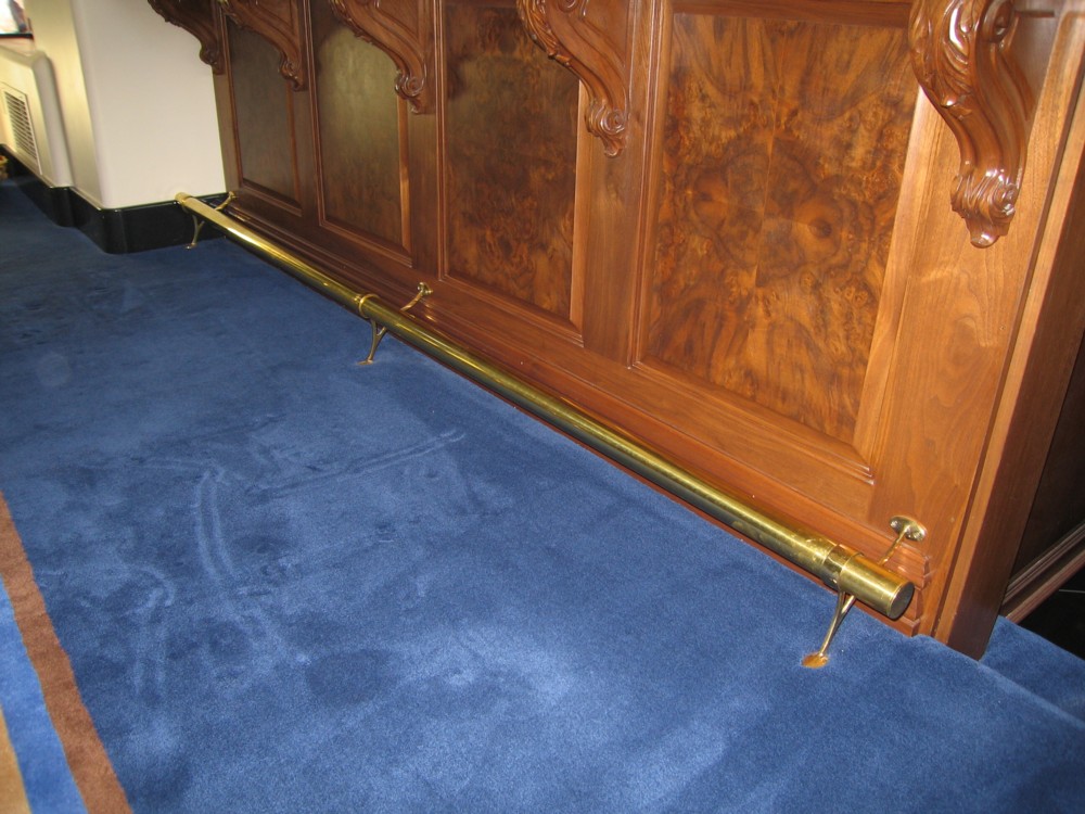 Private residence. Brass with two leg support.