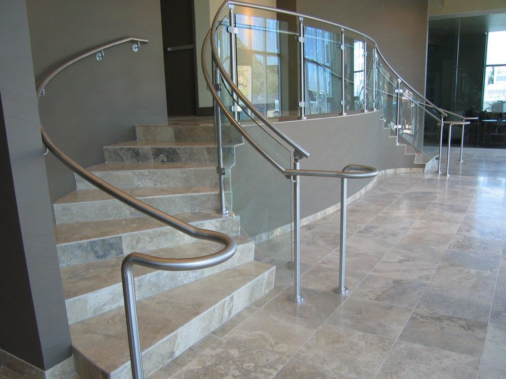 Edgewater - radius glass with stainless steel post and handrail.