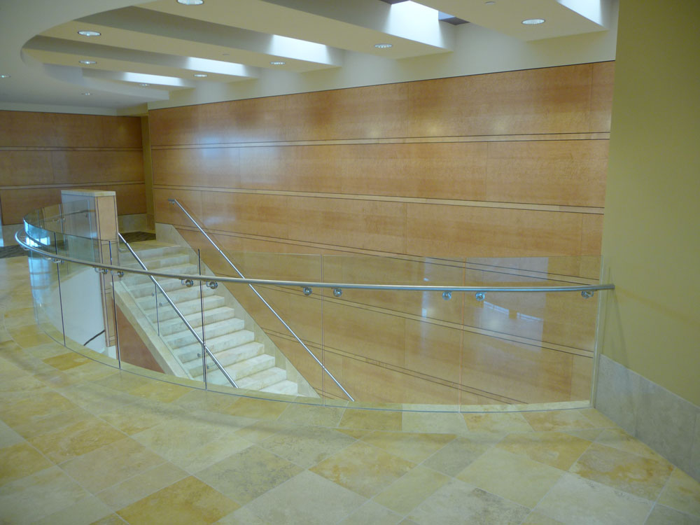 Allred Park Place - Radius glass in custom shoe with Stainless steel handrail.