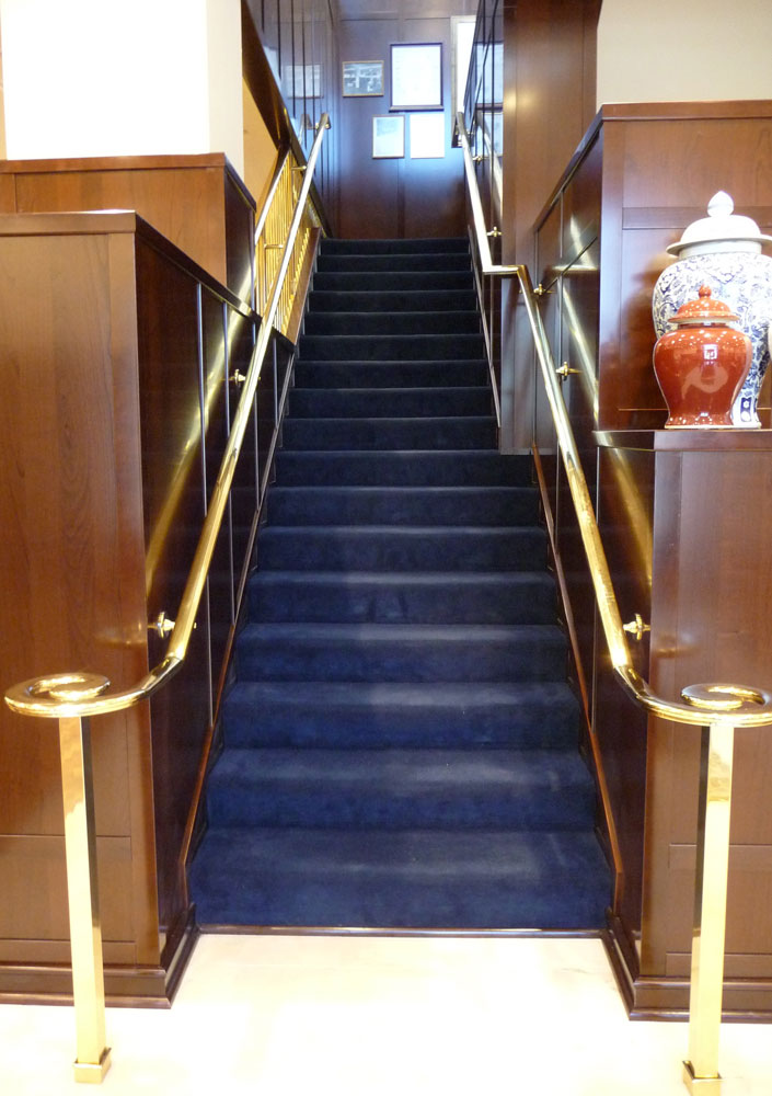 Brooks Brothers - polished brass handrail.