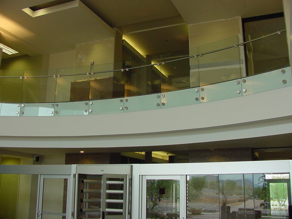 USAA - Segmented glass with stainless steel puck system and handrail.
