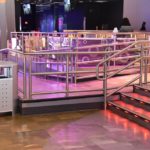 Scope: Custom Illuminated bar rack and illuminated glass guardrails. Contractor: A. R. Mays