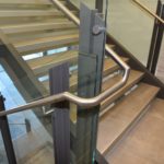 Scope: Custom painted steel post with tempered lami-glass. Contractor: Willmeng Construction